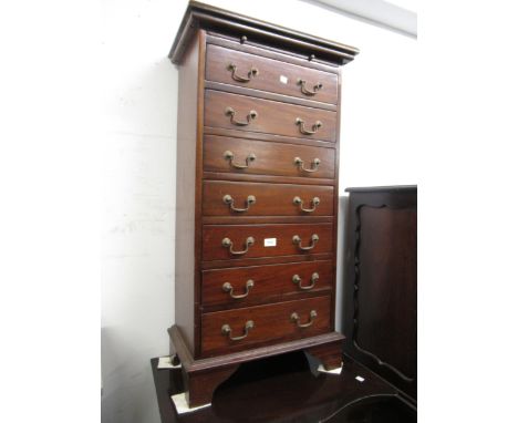 Reproduction mahogany tall chest of seven drawers with brass swan neck handles and brushing slide raised on bracket feet 