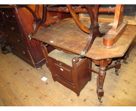 19th Century oak centre table, the moulded top above a shaped carved frieze on turned tapering supports with shaped stretcher