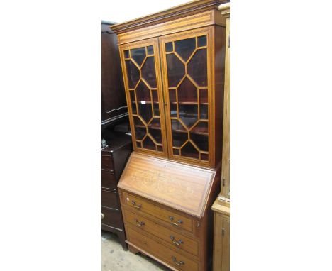 Good quality reproduction satinwood and marquetry inlaid bureau bookcase, the moulded cornice above a pair of astragal glazed