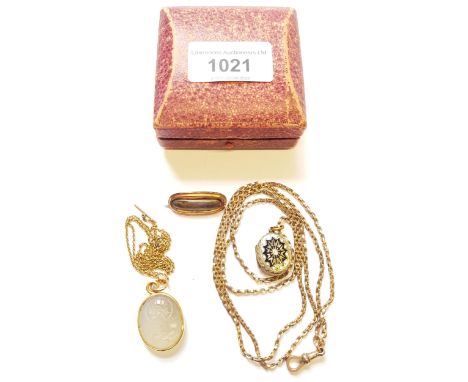 Small enamel decorated photograph locket on a 9ct gold chain, together with a hair inset memorial brooch and a Greek carved h