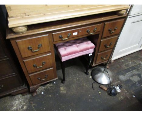 Mid 20th Century walnut twin pedestal desk with a leather inset top above seven drawers, brass swan neck handles and low carv