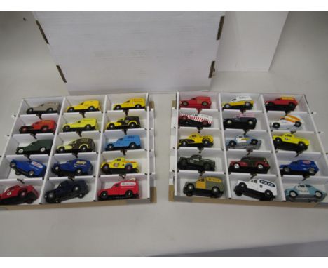 Box containing two trays of mainly Corgi diecast model vehicle Morris Minor cars, police vehicles and advertising vans 