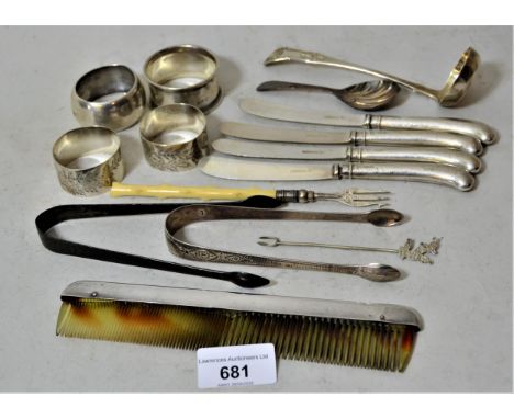Pair of 18th Century silver sugar nips, four pistol gripped butter knives, tea caddy spoon, four silver napkin rings, and a S