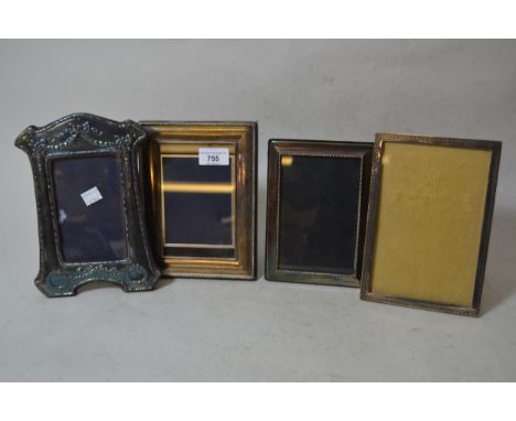 Group of four various modern silver mounted photograph framesAll have easel backs, some minor dents to frames 