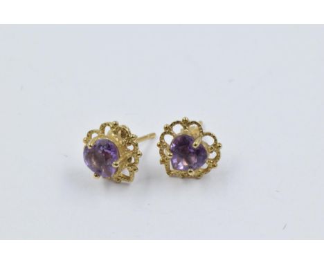 Pair of 9ct Yellow gold amethyst set ear studs 