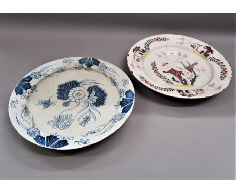 18th Century polychrome Delftware plate decorated with a bird and foliage, 13.5ins diameter (at fault), together with a simil