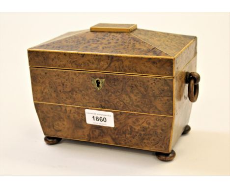19th Century burr yew sarcophagus shaped tea caddy, the hinged cover enclosing a two division interior with ring handles and 