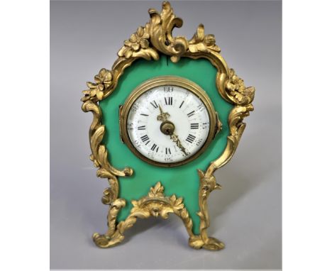Small French gilt metal mantel clock, having circular enamel dial with Arabic and Roman numerals, with a single key wind move