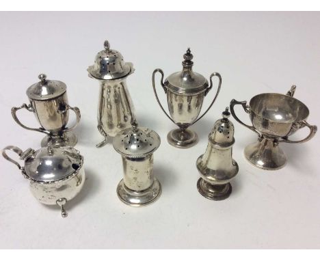 Late Victorian silver pepperette of baluster form, rasied on three hoof feet (Birmingham 1900) together with other silver pep