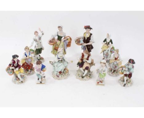 Six pairs of Sitzendorf porcelain figures, mostly with floral encrusted scrollwork bases, printed marks, between 11cm and 19c