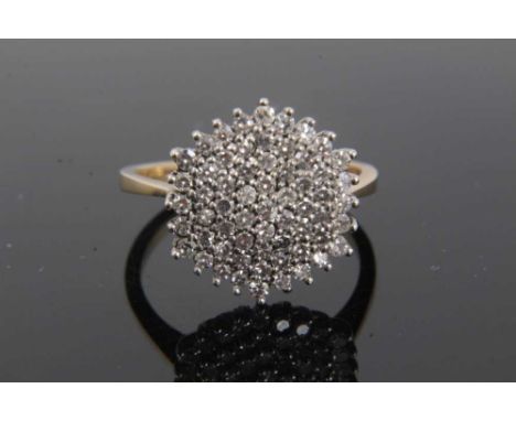 Diamond cluster ring with a hexagonal cluster of 61 single cut diamonds in tiered claw setting on 9ct gold shank. Estimated t
