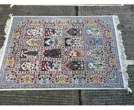 Modern Turkish rug, with cream ground and four rows of four panel reserves of animals and foliage in conforming main borders 