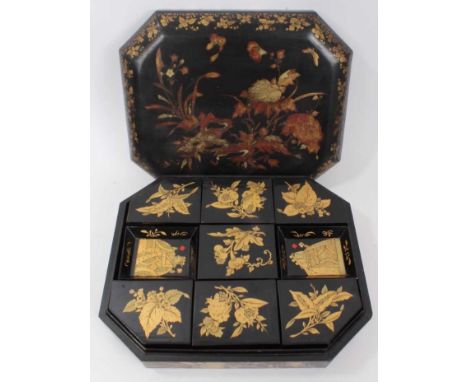 19th century Chinese black lacquer gaming counter box, of canted rectangular cushion form, housing fitted interior with seven