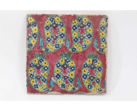 Persian Qajar polychrome painted tile, decorated with a foliate pattern, 24cm x 24cmCondition report: Chips on the edges and 