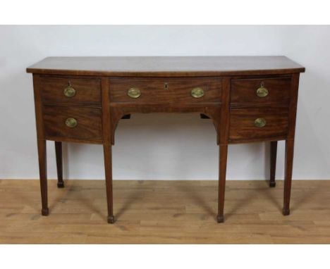 George III mahogany bowront sideboard, with central drawer and flanking deep drawers, the first with unusual fitted caddy com