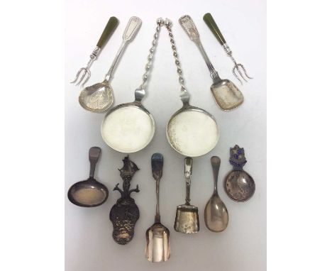 George III silver fiddle pattern caddy spoon (London 1790), together with a silver and enamel Bournemouth souvenir caddy spoo