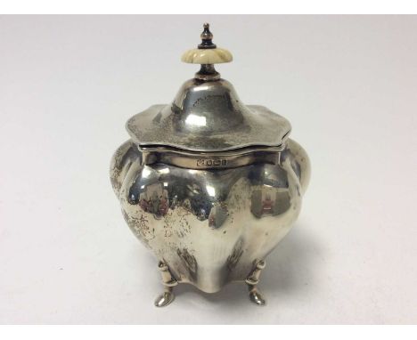 Edwardian silver tea caddy of bombe form, domed hinged cover with ivory finial, raised on four hoof feet, approximately 8oz, 