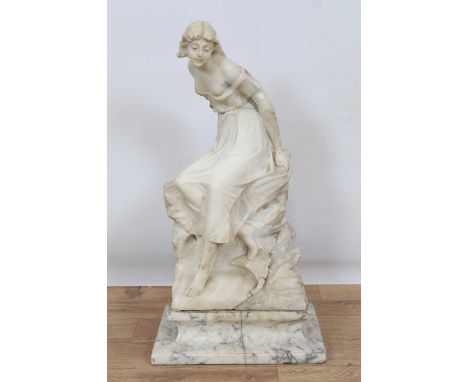 Late 19th Century Continental carved alabaster sculpture of a young maiden, seated on a rocky outcrop, raised on variegated m