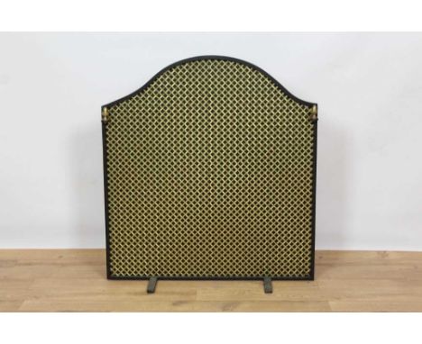 Wrought iron fire basket in the 17th century style, the canted back with raised and heraldic motifs, 60cm wide, together with