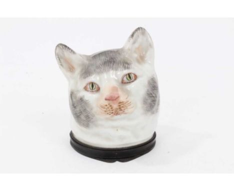 Continental porcelain snuff box, c.1880, in the form of a cat, enamel painted with brass hinged mount, underglaze blue mark i