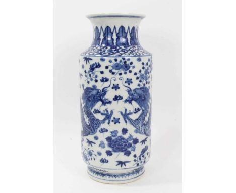 Large 20th century Chinese blue and white vase of cylindrical form, painted with dragons chasing a flaming pearl, 4-character