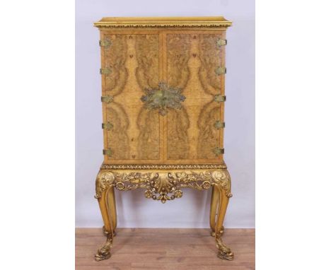 Fine quality George I style figured walnut veneered drinks cabinet on giltwood stand, possibly by Waring & Gillows, with cadd