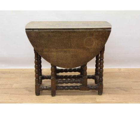 Late 17th century oak oval gateleg dining table with end drawer on bobbin turned understructure, 114 x 84cm