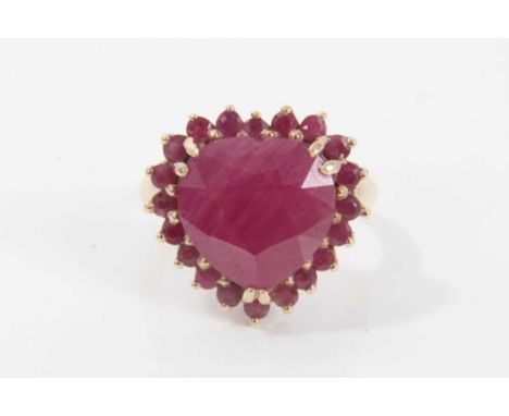 Ruby and gold heart shaped cluster ring with a large heart-shaped ruby (ruby fracture filled) surrounded by a border of mixed