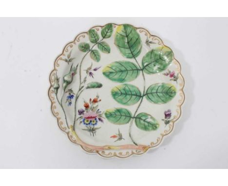 Worcester 'Blind Earl' plate, c.1770, painted with enamels and gilded, and moulded in relief with rose-leaves and buds, 19.5c