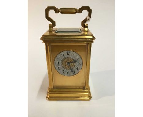 Late 19th century French carriage clock in gilt brass case ,silvered and gilt dial striking on gong , key present 17.5 cm hig