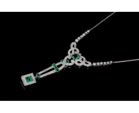 Edwardian style emerald and diamond pendant necklace with a rectangular step cut emerald and diamond cluster suspended from o