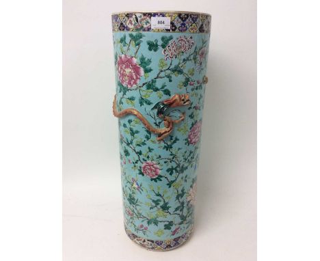 19th century Chinese porcelain stick stand, cylindrical form with raised dragon ornament and meandering foliage on an eggshel