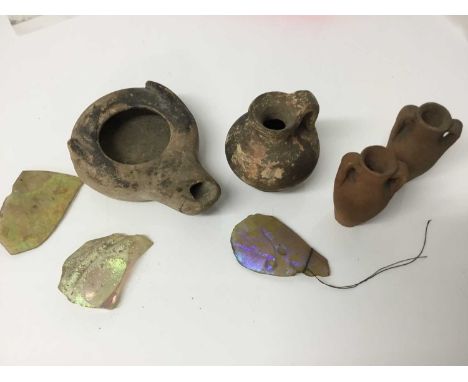 Roman items, including an oil lamp and flagon, a tiny amulet of Jasper, and some items possibly later, including two amphora 
