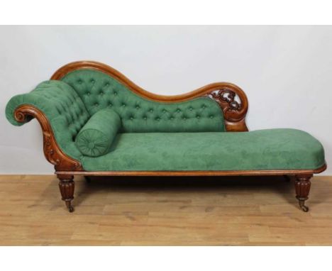 Victorian mahogany chaise longe, with pierced showwood back and green button upholstery on lobed legs and castorsCondition re