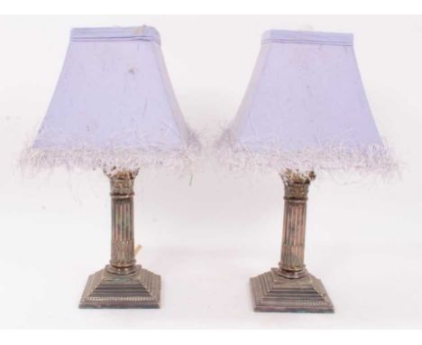 Pair of Edwardian electroplated dwarf Corinthian column candlesticks presented as table lamps, each candlestick 17cm highProv