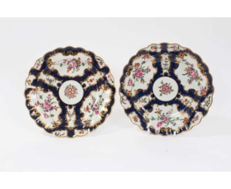 Pair of Worcester dishes, c.1770, painted with floral sprays on a blue scale ground, pseudo-Chinese marks to bases, 20.5cm di