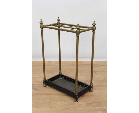 Victorian brass stick stand, of slatted form with iron tray below, 47cm wide