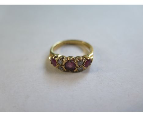 An 18ct gold ruby and diamond ring, approx 4.1 grams, size K, diamonds bright, in good condition 