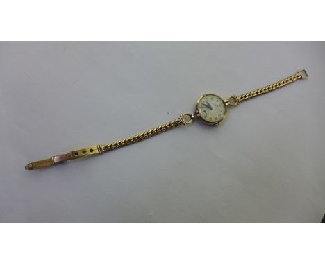 A ladies Rolex 9ct gold precision manual wind wristwatch on a 9ct strap, total weight approx 17 grams, in generally good cond