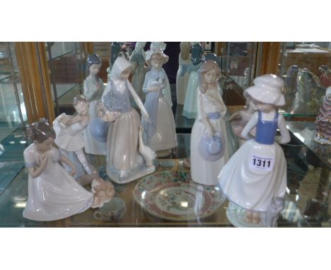 Nine Nao figurines of young ladies and little girls, largest approx 25cm high, in good condition 