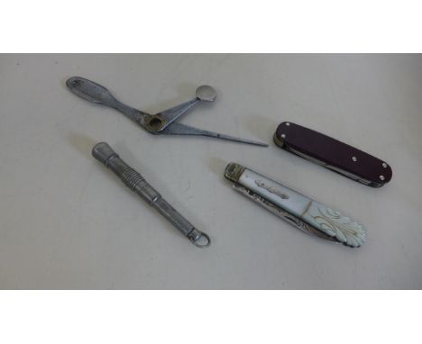 pocket knives and tools including a Victorian silver fruit knife and an early 20th century German made bakelite sided multi-b