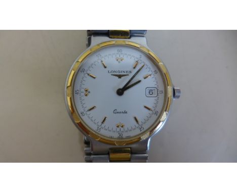 A gents Longines Quartz Conquest wristwatch with bi-metal bracelet, calendar, width of case including button 33mm - with pape