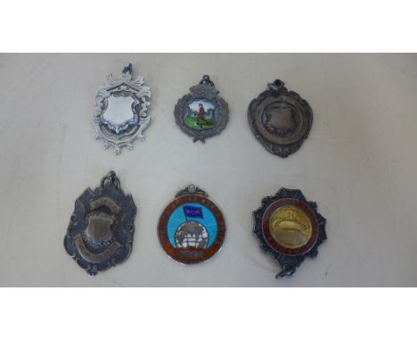 Six silver fobs, three with enamel decoration, approx 2.2 troy oz overall, in good condition 