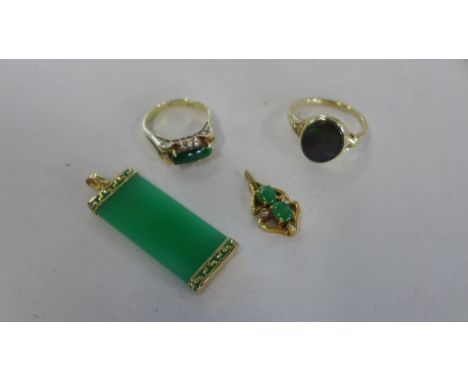 Two 18ct gold pendants and two 14ct gold rings sizes K and P - all generally good condition, total weight approx 14 grams 