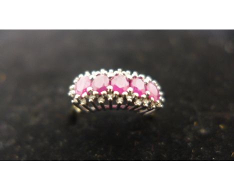 A 9ct gold ruby and diamond ring, size L, 2.7 grams, in good condition 