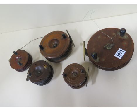 Four wooden vintage fishing reels and a large Eton Sun bakelite reel 