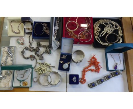 A good assortment of costume and silver jewellery including coral and jade 