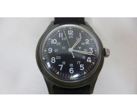 A USA army issued military wristwatch, issued in January 1976 - details on back, manual wind, in working order 