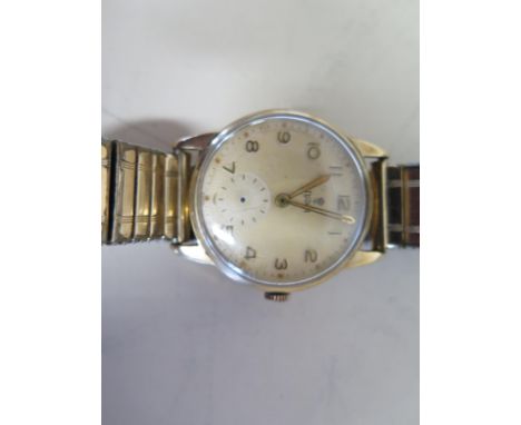 A 9ct yellow gold Tudor manual wind gents wristwatch with a Dennison for Rolex case, case 30mm wide, running order, missing s