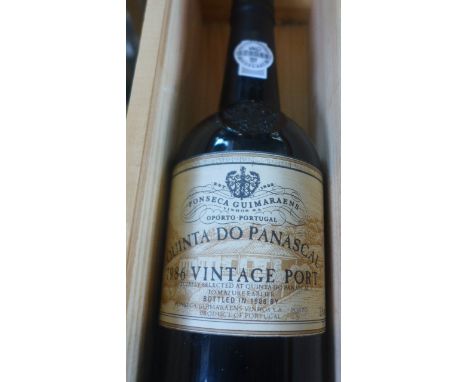 A 1986 bottle of Quinta Do Panascal vintage port with wooden case, with labels, capsule in good unused condition 